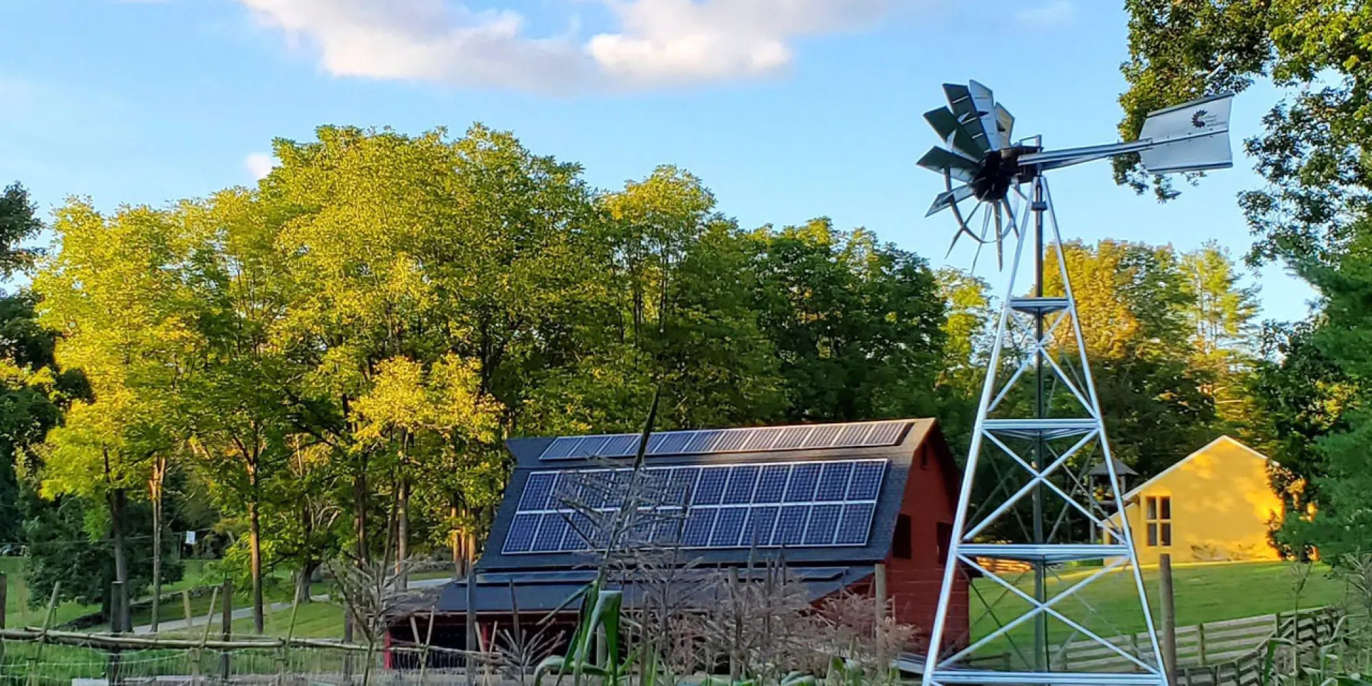 Corn field, Barn with solar panels and a windmill