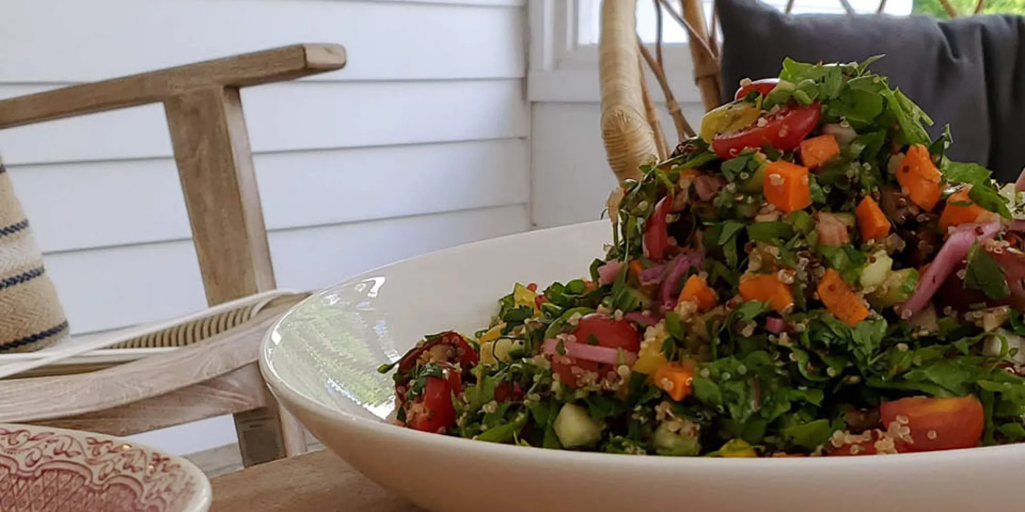 A chopped salad served on the side porch