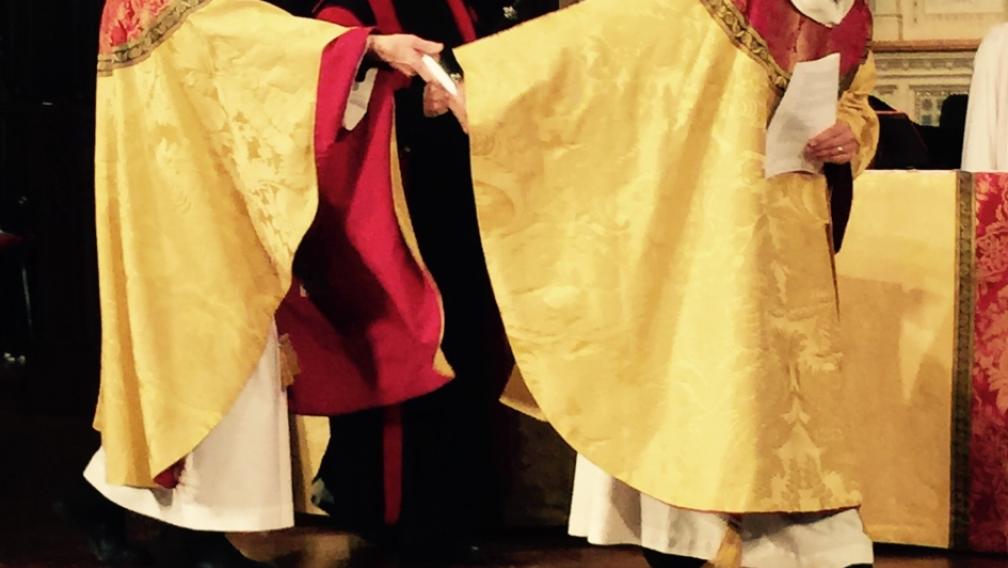 the Rev. Dr. James Cooper, 17th Rector, gave a baton to Lupfer.