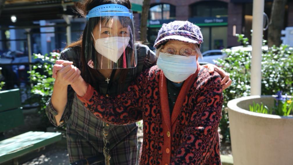 Yuetying Lee (right) and Sing Lam in the garden at St. Margaret’s House. 