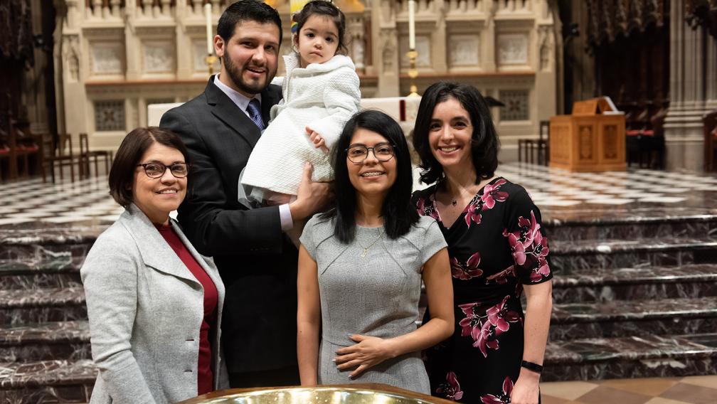 A family poses in Trinity Church on All Saints Sunday 2021