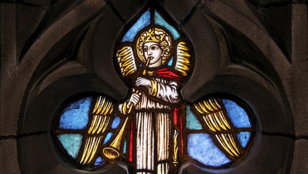 A stained glass window depicting an angel with a trumpet in the Chapel of All Saints in Trinity Church