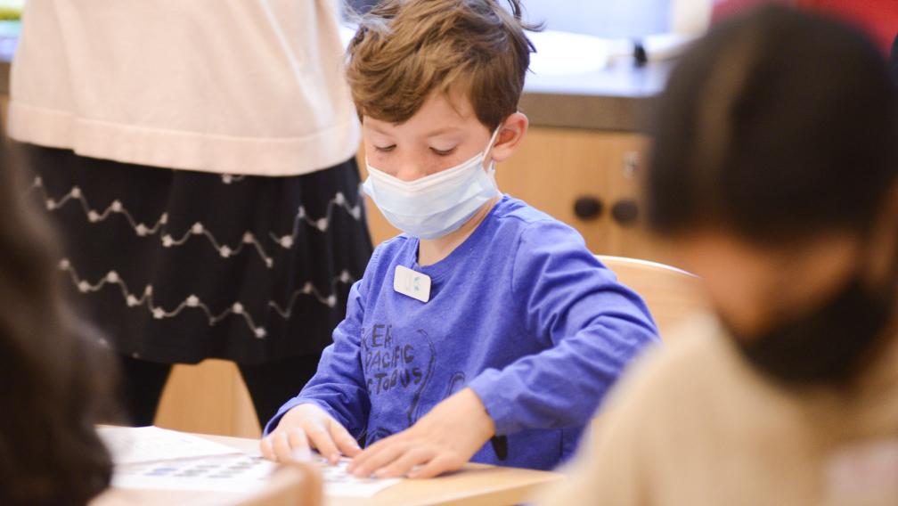 A child works on a project in Children's Time