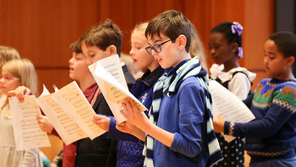 A children's choir sings during Family Service in the Parish Hall