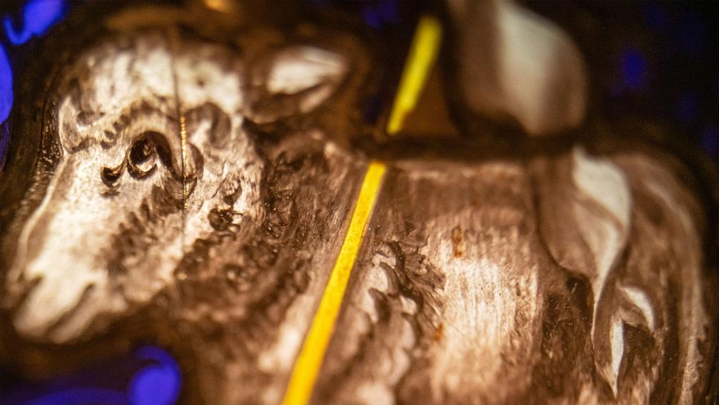 A stained-glass image of a lamb