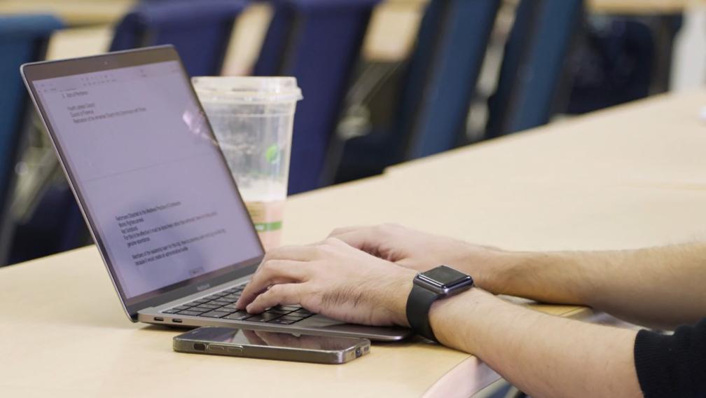 CDSP student's hands typing on laptop