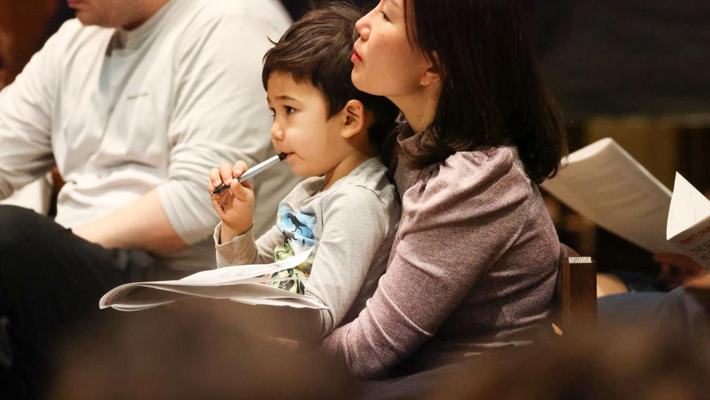 A child and adult together during 9am worship at Trinity Church