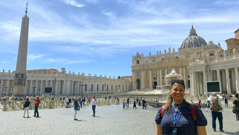 Woman stands in St. Peter's Square