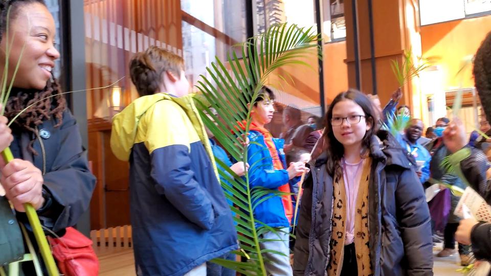 Trinity parishioners and families walk on pilgrimage on Palm Sunday.