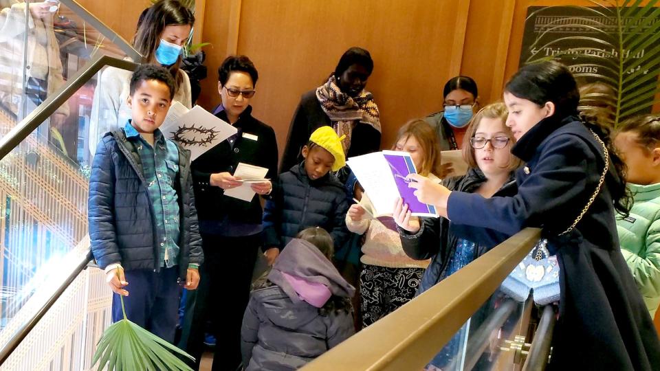 Trinity parishioners and families walk on pilgrimage on Palm Sunday.