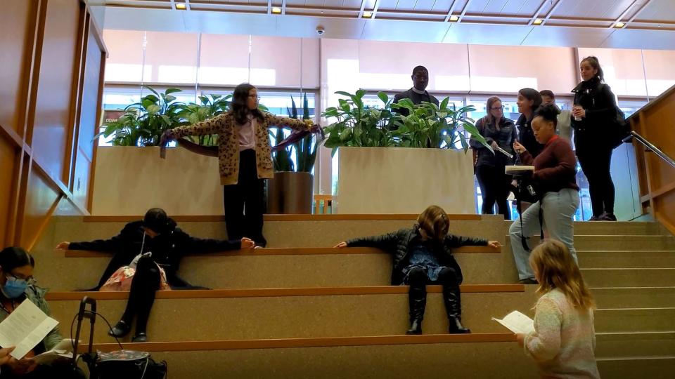 Trinity parishioners and families act out Jesus's final moments on Palm Sunday.