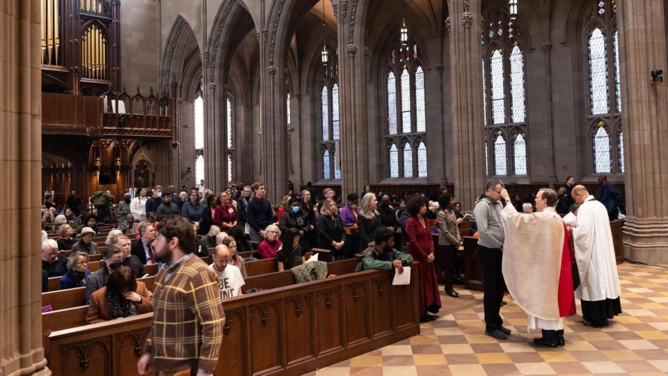 Parishioners line up to receive ashes on Ash Wednesday in Trinity Church