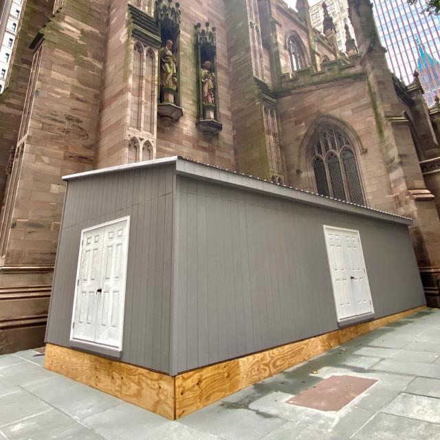 A shed to store organ construction materials in Trinity Churchyard