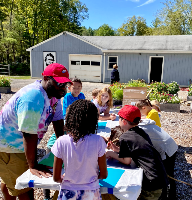 Wayne Edwards working with children at the Labor Day Family Retreat 2022
