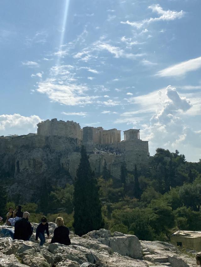 View of ancient buildings on top of a hill far away