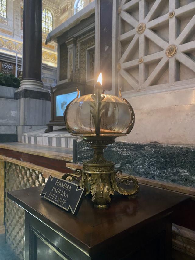 Glass globe lantern sitting on table