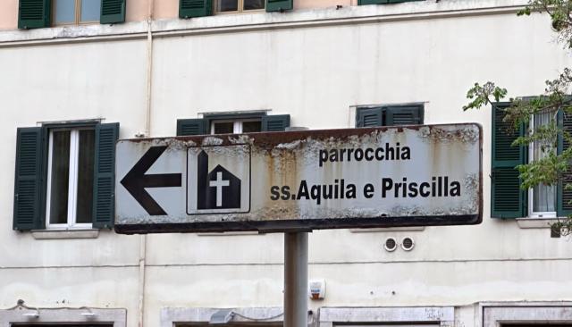 Street sign pointing to Aquila and Priscilla street in Rome