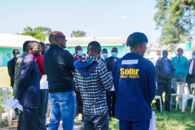 Bishop Ignatius Makumbe of the Diocese of Central Zimbabwe, colleagues, and community members gather for the unveiling of the solar farm. 