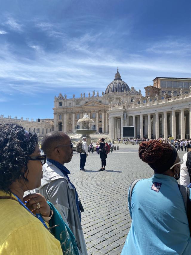 People stand in St. Peter's Square