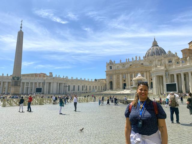 Woman stands in St. Peter's Square