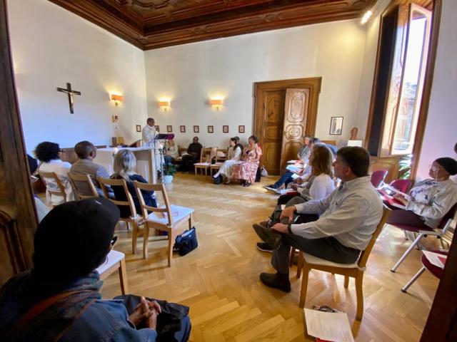 People sit together in a circle