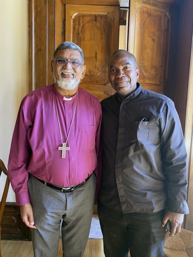 Two men stand together