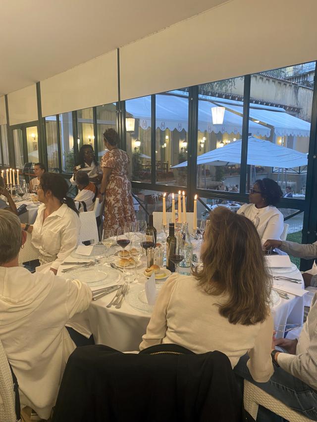 People sit around a table at dinner