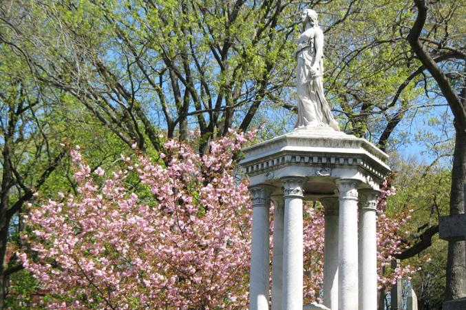 One of the historic sculptures at the Cemetery & Mausoleum. This one is a hexagonal structure with six Corinthian columns topped with a life-sized, stone figure of a woman