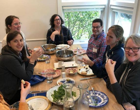 A group of six enjoy family-style dining 