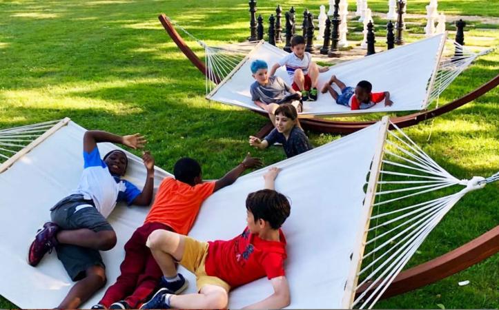 Kids play in hammocks 