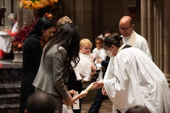 A child is blessed in Trinity Church on All Saints Sunday 2021