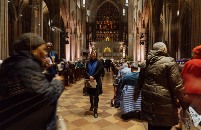 People find their seats in Trinity Church.