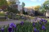 The mausoleum in spring, with purple flowers.