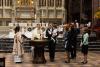 A child is baptized in Trinity Church on All Saints Sunday 2021