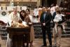 A child is baptized in Trinity Church on All Saints Sunday 2021