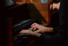 Close-up of hands playing a harpsichord