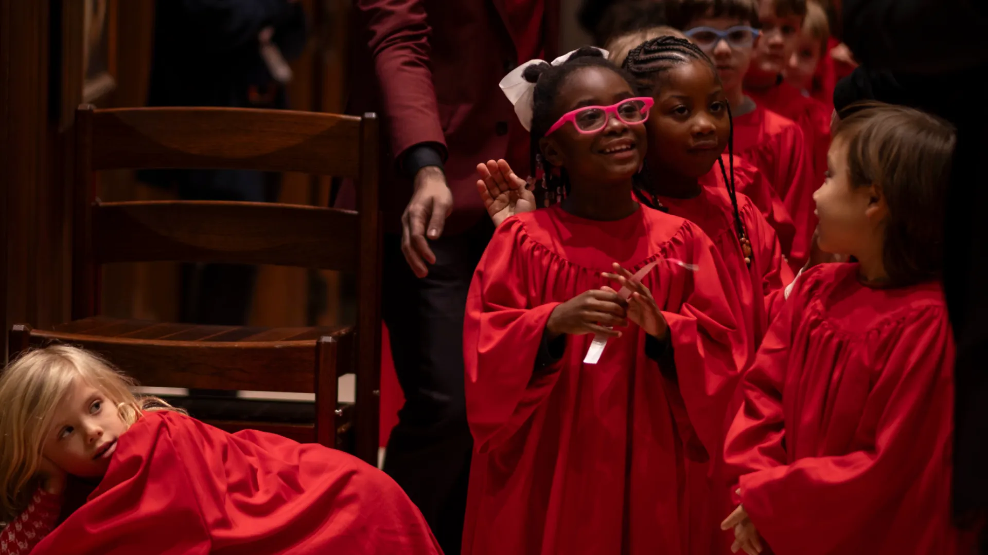 Kids line up in the aisle in the church