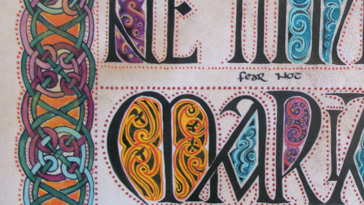 Image of an illuminated manuscript with ornate calligraphy with gold, blue and purple accents.