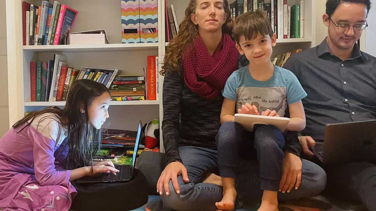 Retreat leader meditates while with her family