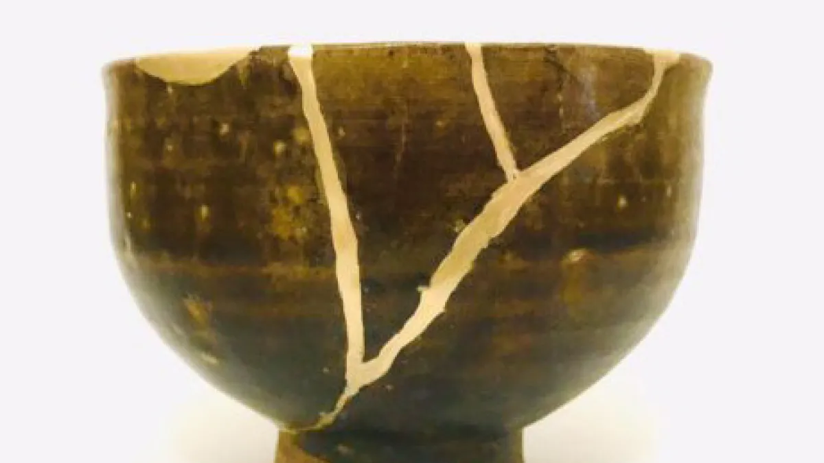 Broken ceramic bowl mended with gold