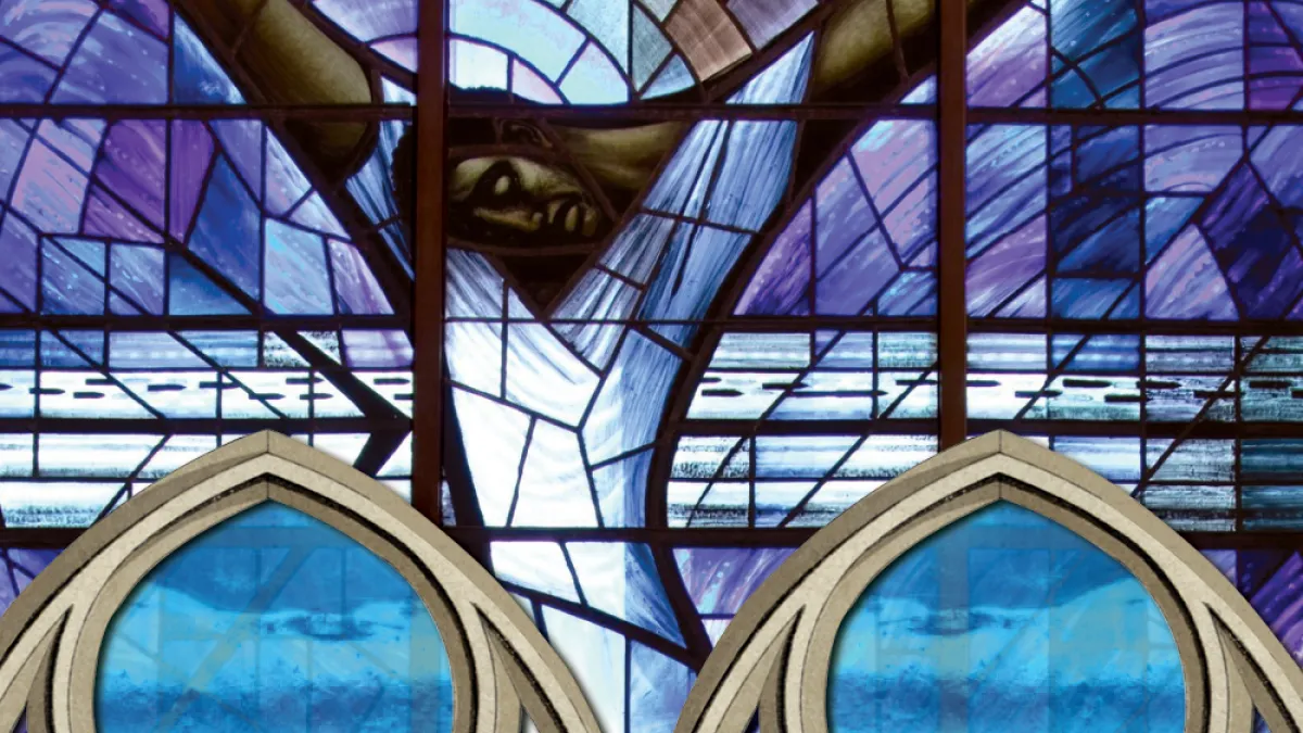 Stained glass image of man with arms outstretched