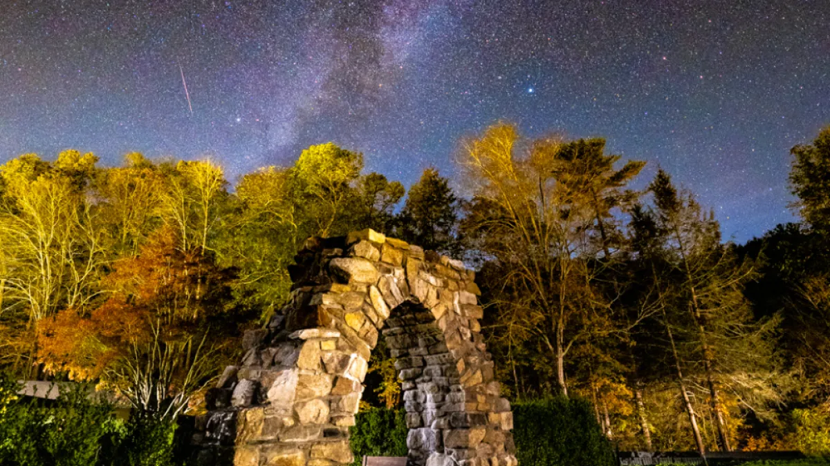 Stone arch with Milky Way galaxy