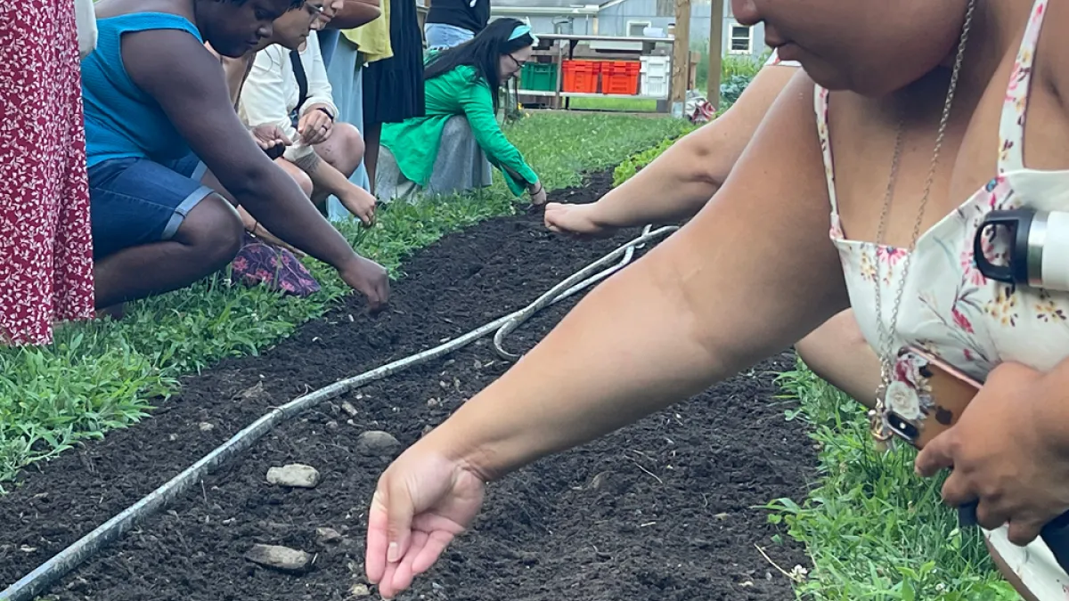 Retreatants sow seeds at the Trinity Retreat Center farm