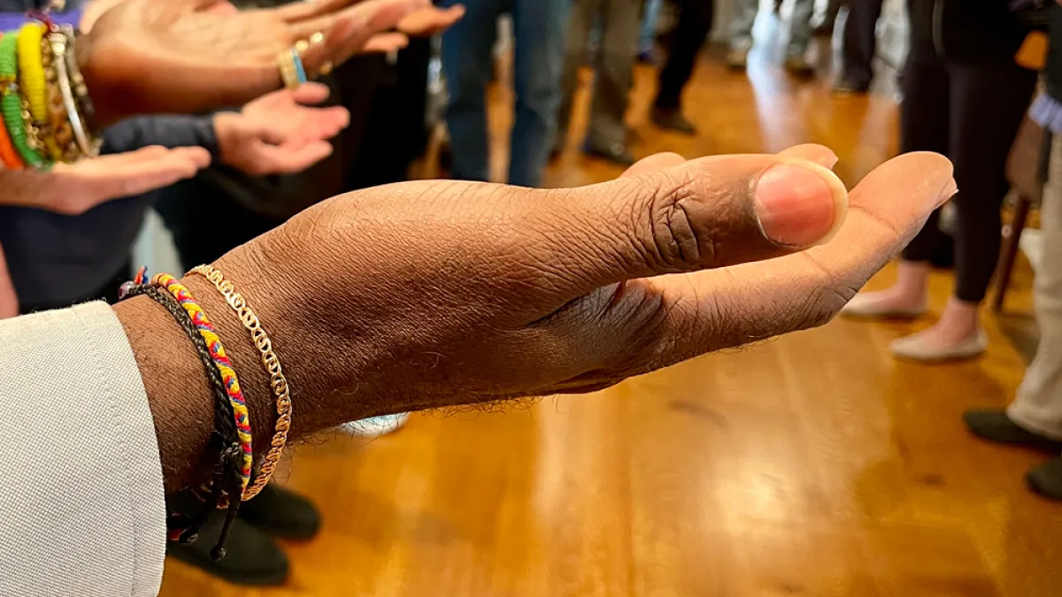 Hands raised in prayer