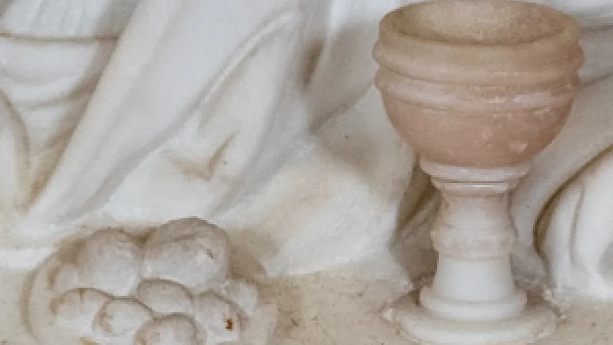 Marble relief of chalice and plate of bread