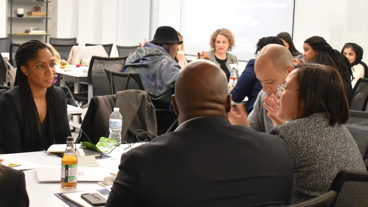 Racial Justice initiative staff and grantees speak in small groups during the November 2019 Racial Justice Grantee Convening.