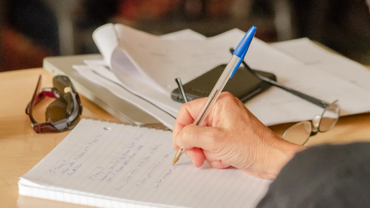 Person writing in a notebook