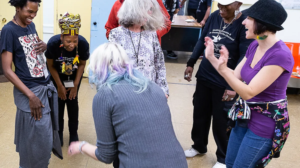 People dance at a workshop led by dance company Urban Bush Women