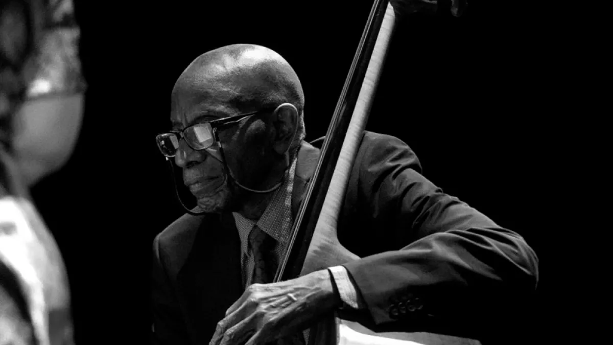 Reggie Workman plays an upright bass