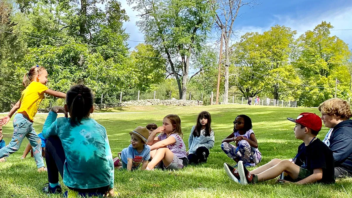 Kids play on the lawn at the Trinity Retreat Center